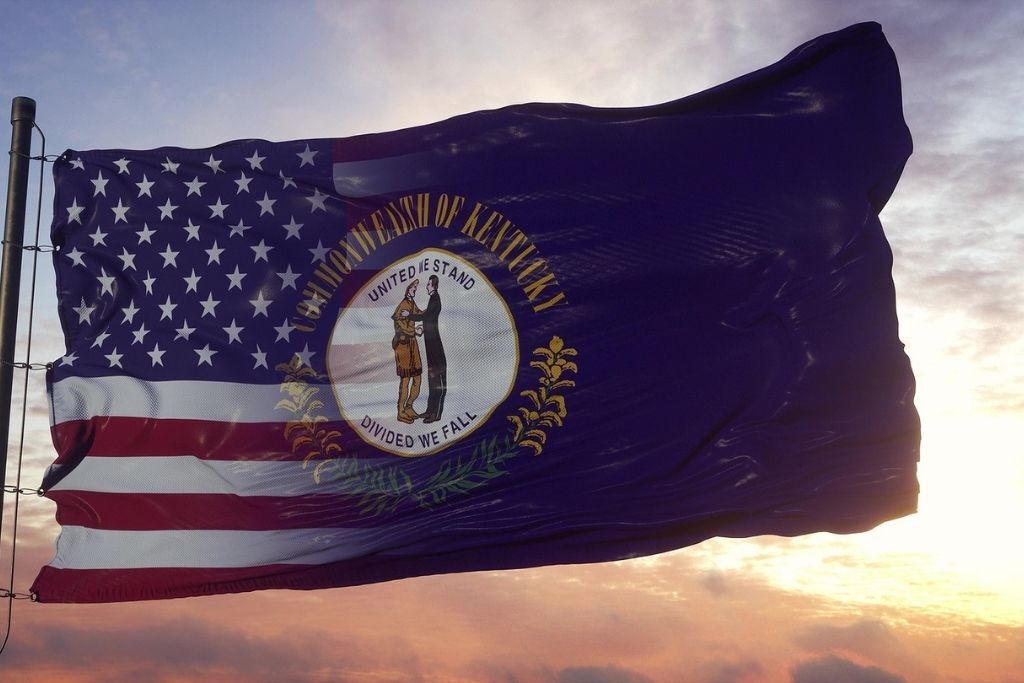 Kentucky and USA flag on flagpole. USA and Kentucky Mixed Flag waving in wind. 3d rendering. Concept of Kentucky detox.