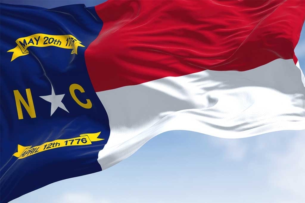 Close-up view of the North Carolina state flag waving. Representing North Carolina Rapid Detox