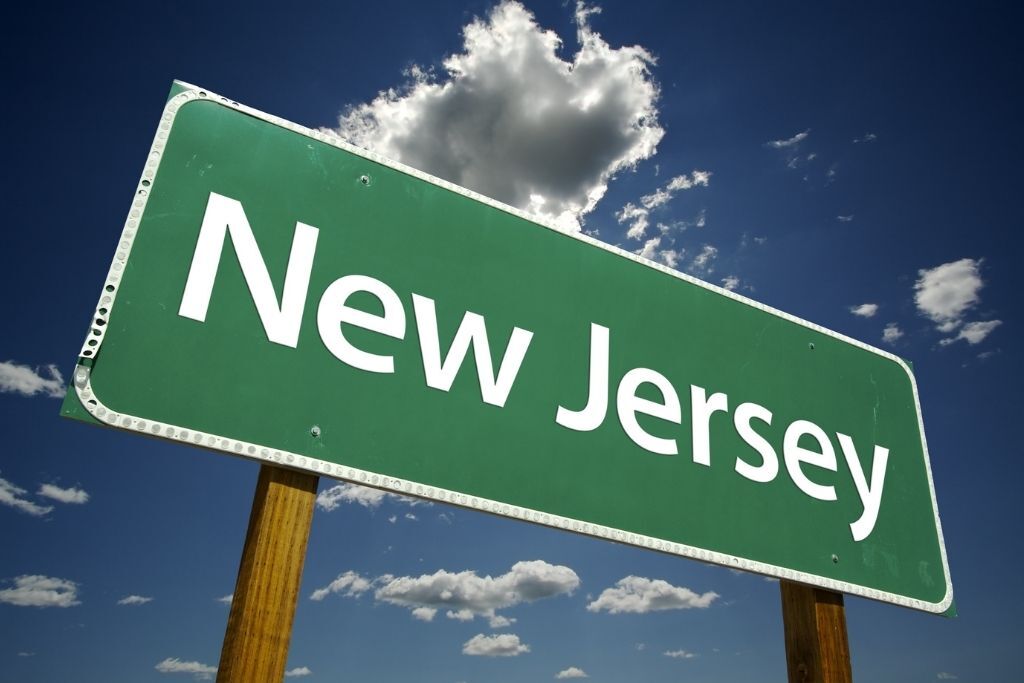 New Jersey Road Sign with dramatic clouds and sky, concept of rapid detox in New Jersey